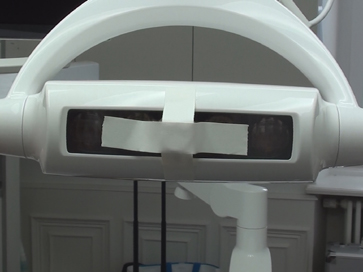 keeping miniature camera mount in place with adhesive tape